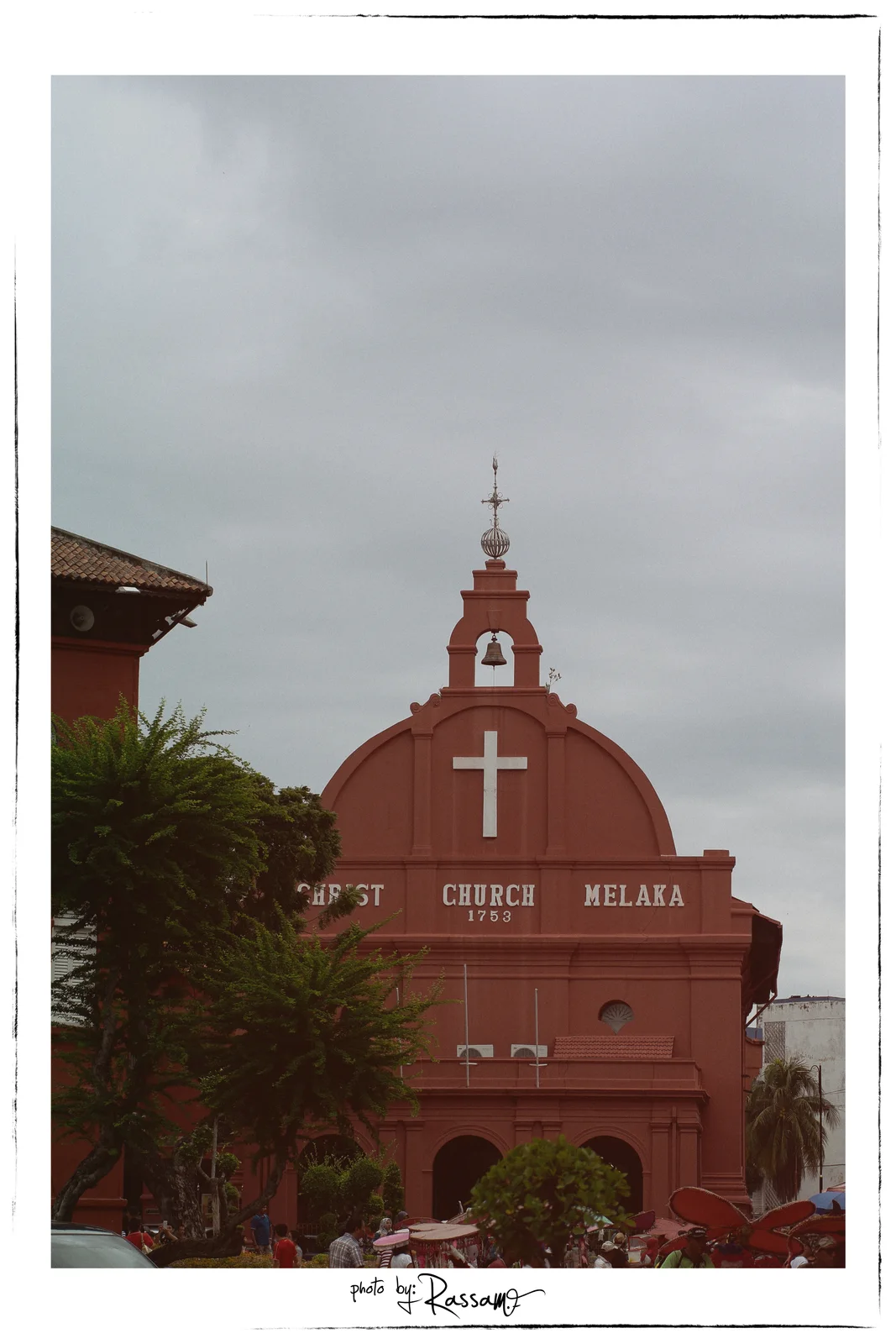 Christ Church Melaka, a red Dutch church dated 1753, under a heavy grey sky